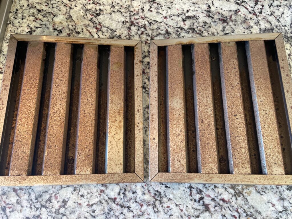 A hood vent before Xtreme Grill Clean cleaned and serviced it